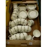 A tray containing a part tea set with a