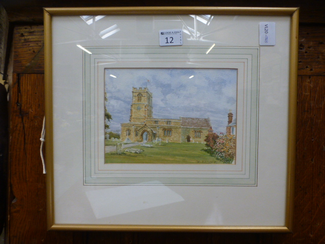 A framed and glazed watercolour of churc