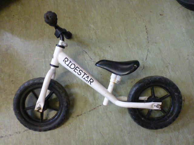 A child's white balance bike
