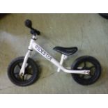 A child's white balance bike