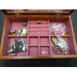 A jewellery box containing an assortment