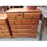 A modern pine chest of two short over fo