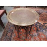 A brass engraved circular eastern tray t