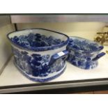 A blue and white ceramic foot bath toget