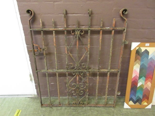 A wrought iron garden gate