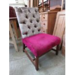 A mahogany framed up-cycled chair with a