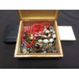 A jewellery box containing an assortment