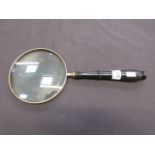 A 6'' silverplate magnifying glass