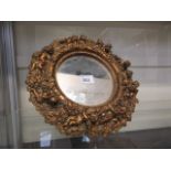 A small gilt mirror