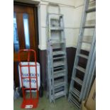 Two pairs of folding metal step ladders