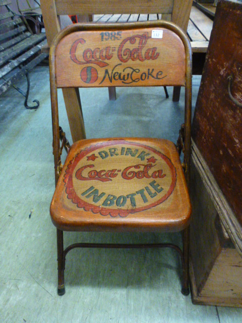 A painted folding chair - 'Coca Cola'