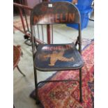 A painted folding 'Michelin' chair