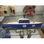 A wind up tin plate boat by Hornby/Mecca