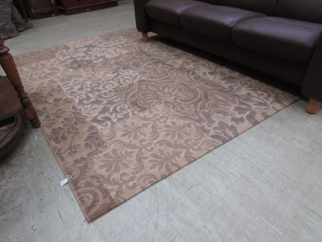 A beige and brown patterned rug