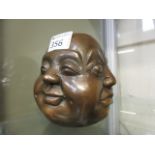 A Four faced Buddha head