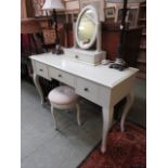 A modern cream dressing table with mirro