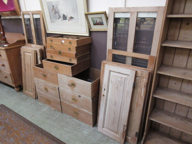 An assortment of pine drawers and doors