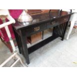 A black painted hall table with three dr