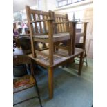 A teak garden table with a pair of match