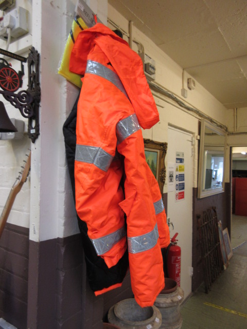 A hi-vis jacket together with a bagged r