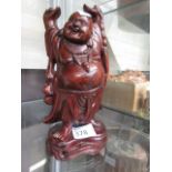 A Chinese carved hardwood figure of a Bu