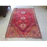 A red ground eastern style rug