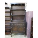 A mid-20th century stained oak dresser w