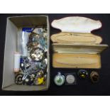 A shoe box of assorted costume jewellery