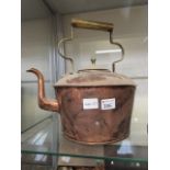 A large copper and brass kettle