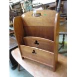 A mid-20th century walnut magazine rack