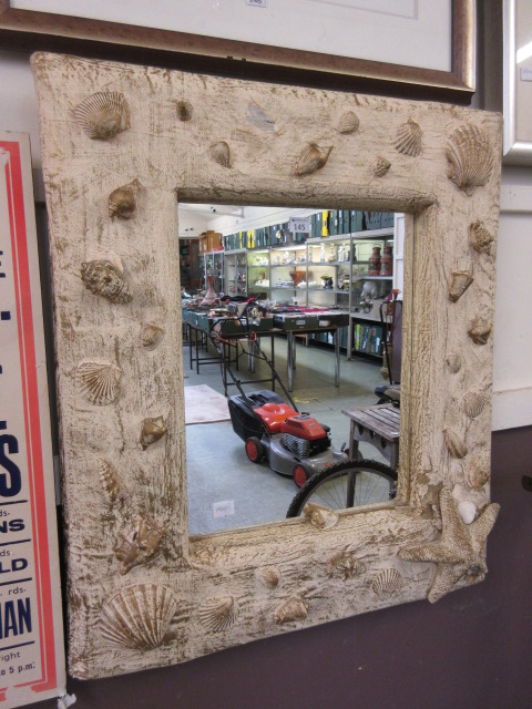 A modern shell design framed mirror