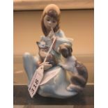 A Lladro figure of a girl with cat and p