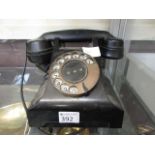 A mid-20th century dial up telephone