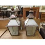 A pair of copper and glass lanterns