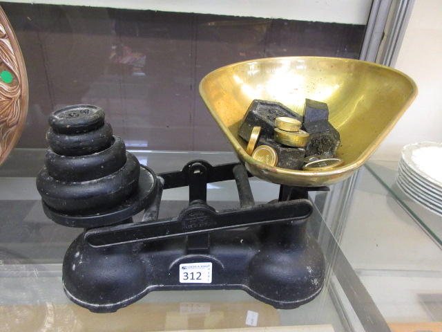 A pair of cast metal kitchen scales with