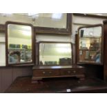A mahogany dressing triple vanity mirror
