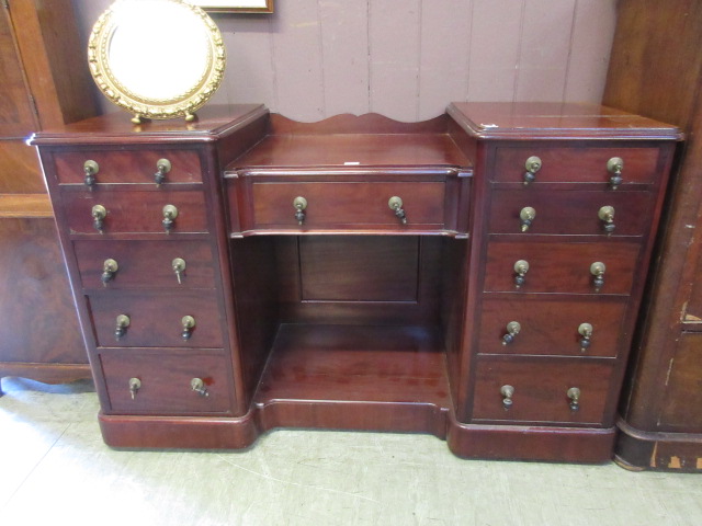 A Victorian style mahogany sideboard hav