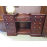 A Victorian style mahogany sideboard hav