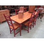 A large modern pine rectangular table wi