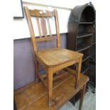 An early 20th century school chair havin