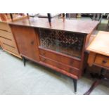 A mid-20th century sideboard having a si