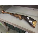 A decorative wall hanging blunderbuss