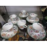 A selection of Minton cups and saucers h