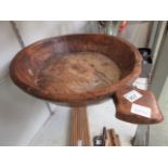 A carved wooden dough bowl