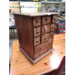 An eastern hardwood multi drawer cabinet