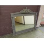 A grey painted over mantle mirror