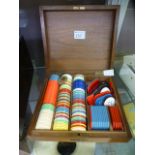 A wooden case of gambling tokens