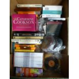 A tray containing Catherine Cookson cassettes, Two Ronnie DVDs, reel-to-reel tapes etc.