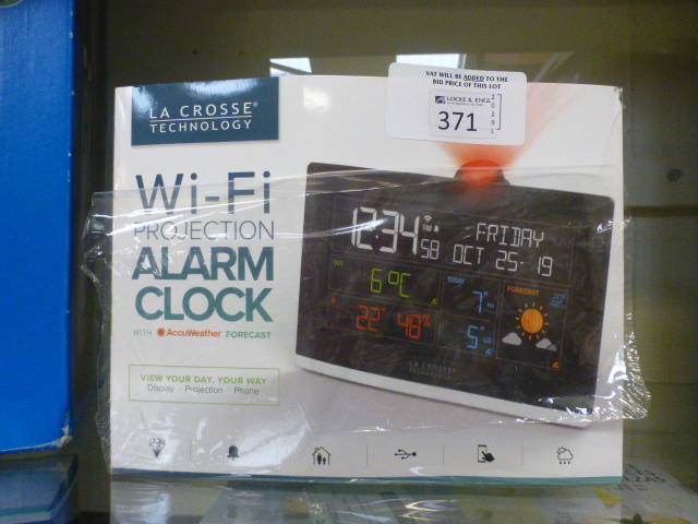 A boxed Wi-Fi projection alarm clock