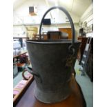 A large galvanized bucket with iron handle